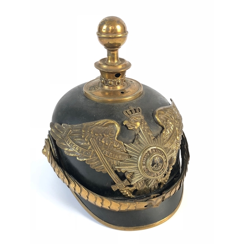 340 - WW1 Prussian Guard Artillery Officer’s Pickelhaube This example with leather skull, mounted with a g... 