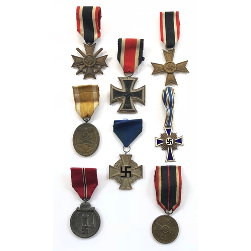 342 - German Third Reich. Eight assorted medals.  Iron Cross 1939 2nd Class ... War Merit Cross 1939 with ... 