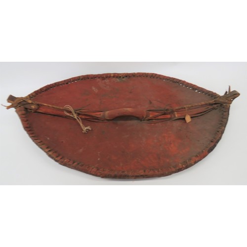 171 - Late 19th Century African Maasai Shield 30 inch, oval, leather shield with wooden edge frame secured... 