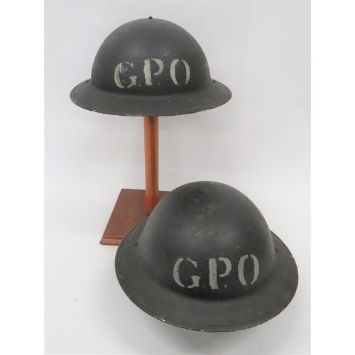 261 - Two WW2 GPO MKII Steel Helmets consisting black painted, MKII steel helmet. The front with white ste... 