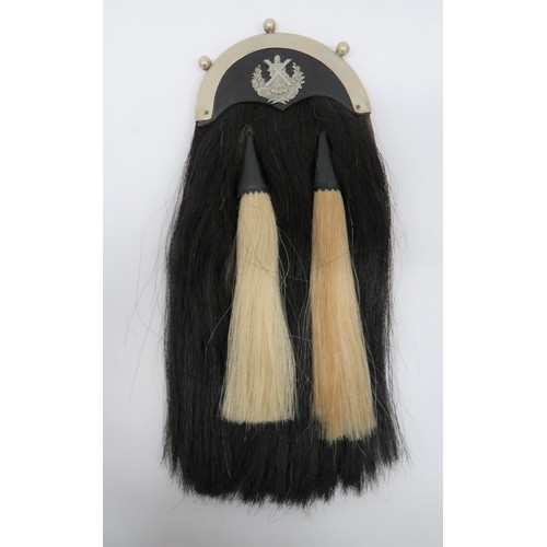 357 - Cameron Highlanders Sporran black horsehair sporran with two white horsehair tassels, both with blac... 