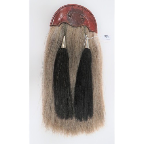 354 - London Scottish Sporran brown and fawn horsehair sporran with two black horsehair tassels, both with... 