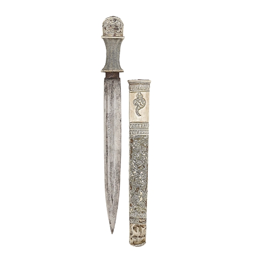 557 - Burmese Dagger with Silver Decoration. This Burmese dagger with a 10 1/2 inch double edged blade. Th... 