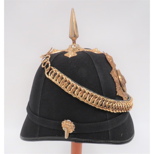 219 - Post 1953 East Surrey Bandsman's Home Service Helmet
black melton cloth, four panel crown.  Rounded ... 