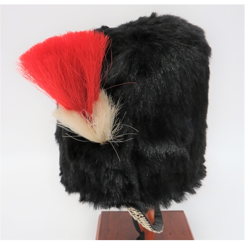 225 - Post 1953 Royal Regiment of Fusiliers Fur Cap
black, short fur busby.  The right side fitted wi... 