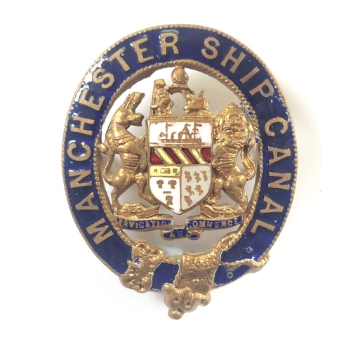 165 - Manchester Ship Canal Cap Badge.
A gilt and enamel example complete with loops.