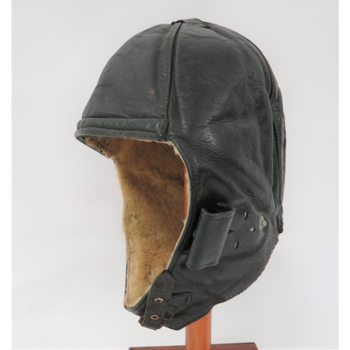 102 - Interwar Period Leather Flying Helmet
black leather, six panel helmet.  Roll up, leather ear flaps. ... 