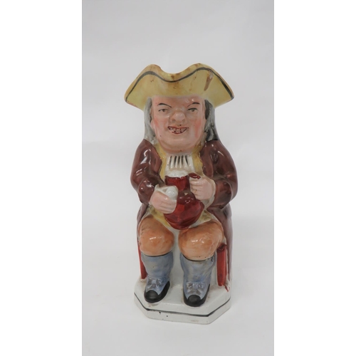 342 - 19th Century Toby Jug
brown glazed jacket example.  Holding his jug and pipe bowl.  Yellow tricorn. ... 