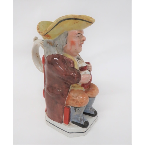 342 - 19th Century Toby Jug
brown glazed jacket example.  Holding his jug and pipe bowl.  Yellow tricorn. ... 