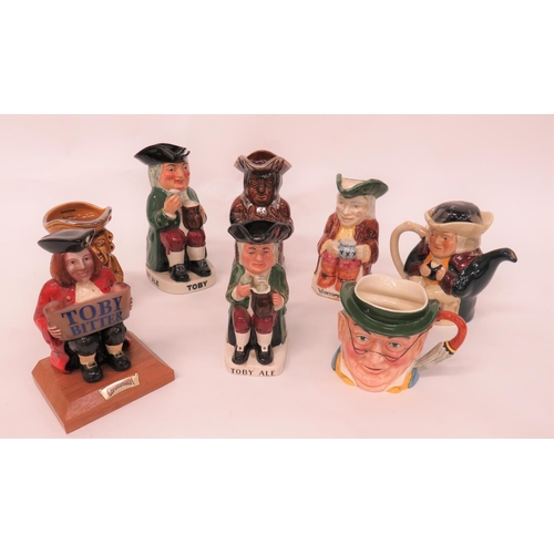 351 - Eight Various Toby Jugs Including Advertising
including Toby Bitter bar advertising figure ... Charr... 