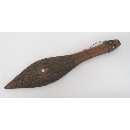 387 - 20th Century Carved New Zealand Club
19 inch, carved wooden, flat base club.  The oval head wit... 