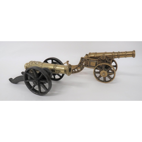 216 - Two Early 20th Century Model Cannons
consisting cast brass barrel with rear, faint coat of arms.  Ca... 