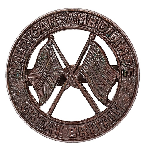 217 - WW2 American Ambulance Great Britain cap badge.  Good scarce large die-cast bronze title circlet; cr... 