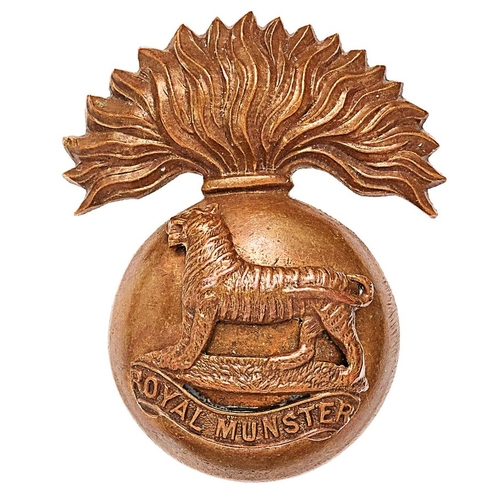 227 - Irish. Royal Munster Fusiliers OSD cap badge circa 1902-22.  Good scarce die-cast bronze flaming gre... 