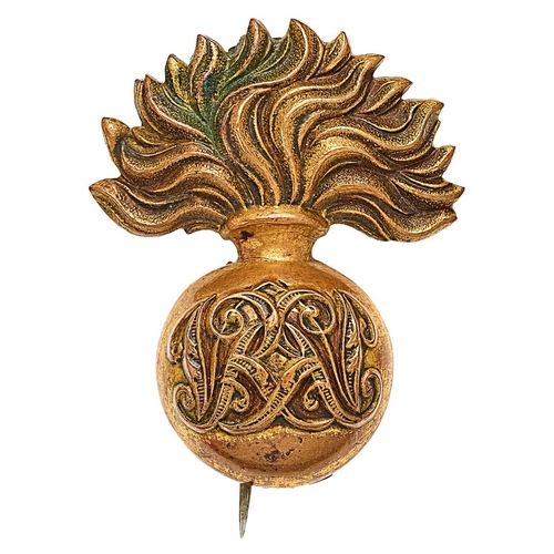 250 - Grenadier Guards Victorian cap badge.  Good die-stamped gilded brass flaming grenade; the ball beari... 