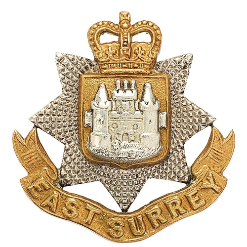 323 - East Surrey Regiment Officers cap badge circa 1953-59. Good die-cast silver facetted star on gilt ti... 