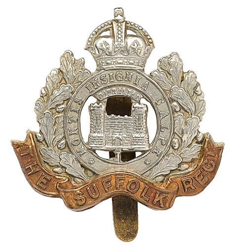 335 - Suffolk Regiment Edwardian two tower
 cap badge.  Good scarce die-stamped white meal crowned MONTIS ... 