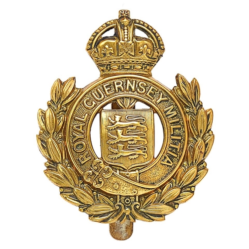 371 - Royal Guernsey Militia Channel Islands cap badge circa 1925-40.  Good scarce die-stamped brass crown... 