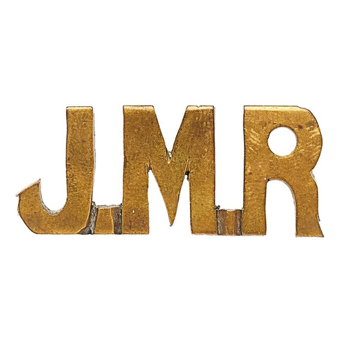 436 - South Africa. Johannesburg Mounted Rifles Boer War sheet brass shoulder title.  Good sans-serif JMR.... 