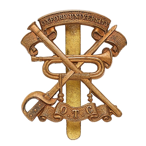 458 - Oxford University OTC Cavalry Section brass cap badge.  Die-stamped crossed sword and scabbard betwe... 