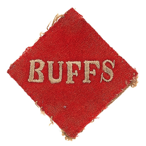 551 - The Buffs, East Kent Regiment cloth pagri badge.  Good scarce red felt diamond bearing white embroid... 