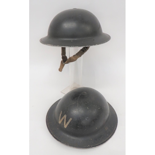 204 - Two WW2 British Home Front Steel Helmets
consisting black painted crown.  The front with white ... 