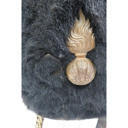 218 - Pre WW1 Royal Welch Fusiliers Fur Busby
black fur, short crown busby.  The front with brass, Ro... 