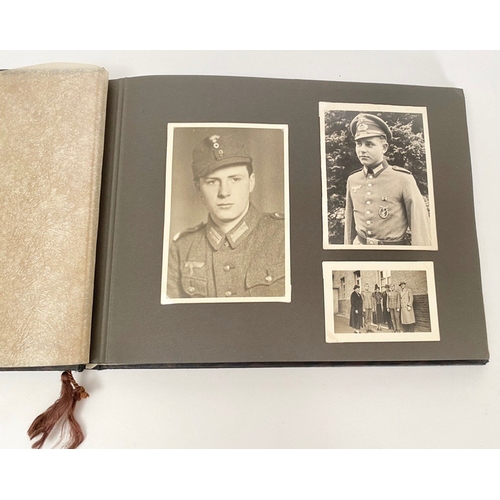 398 - German Third Reich WW2 Army Photograph Album.  The front is mounted with a German helmet and MEINE D... 