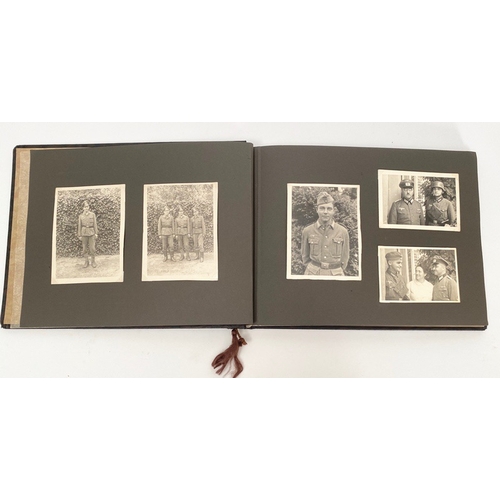 398 - German Third Reich WW2 Army Photograph Album.  The front is mounted with a German helmet and MEINE D... 