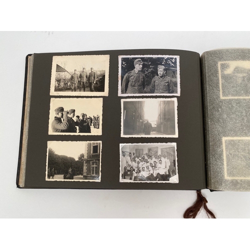 398 - German Third Reich WW2 Army Photograph Album.  The front is mounted with a German helmet and MEINE D... 