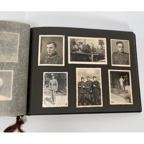 398 - German Third Reich WW2 Army Photograph Album.  The front is mounted with a German helmet and MEINE D... 