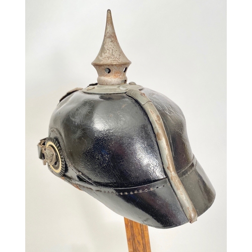 432 - Imperial German WW1 Prussian State Pickelhaube  A good example polished black leather skull, with gr... 