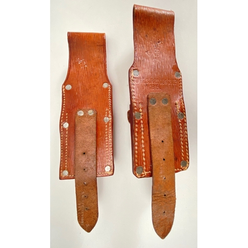 516 - Two WW1 1914 Leather Equipment 1915 dated Bayonet Frogs.  Both good examples complete with retaining... 