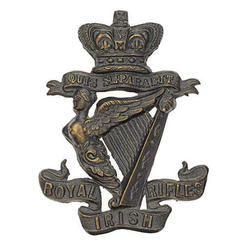Royal Irish Rifles Victorian glengarry badge circa 1881-96.  Good scarce die-stamped blackened brass crowned QUIS SEPARABIT over Maid of Erin Harp on tri-part title scroll.    Loops.  VGC
