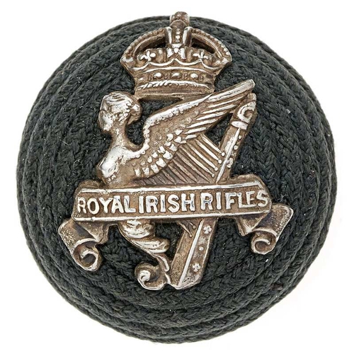 Irish. Royal Irish Rifles Officer pre 1921 green cord boss bearing silver badge.  Badge being crowned Maid of Erin Harp with central title scroll.      GC