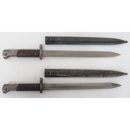 123 - Two Czech M1924 Bayonets
11 3/4 inch, single edged blade with fuller.  Steel muzzle ring, cross... 