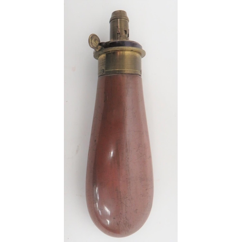 Mid 19th Century Powder Flask by Bartram & Co
3 3/4 inch, browned copper body.  Brass top with exposed spring. Maker stamped "Bartram & Co".  Adjustable brass nozzle.  Uncleaned original condition.  