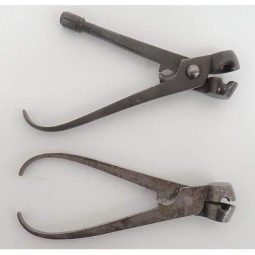 Two Mid 19th Century Steel Bullet Moulds
steel ball pincer moulds.  One with lower fitted nipple key.  The arm stamped "No 36".  The other plain example stamped "34".  2 items.