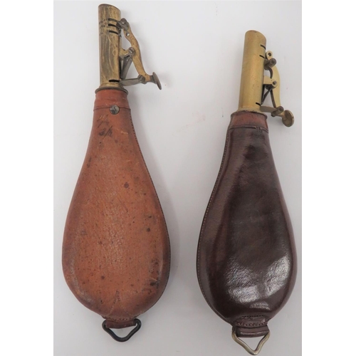 275 - Two 19th Century Leather Shot Flasks
consisting brown leather bag flask.  The front embossed wi... 