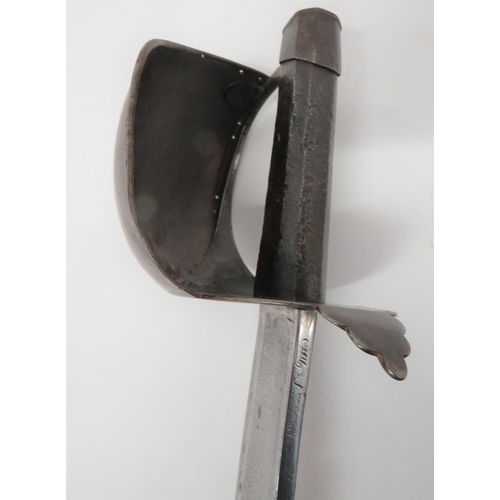 65 - French M1833 Naval Cutlass
26 3/4 inch, single edged, slightly curved blade with wide fuller.  Back ... 