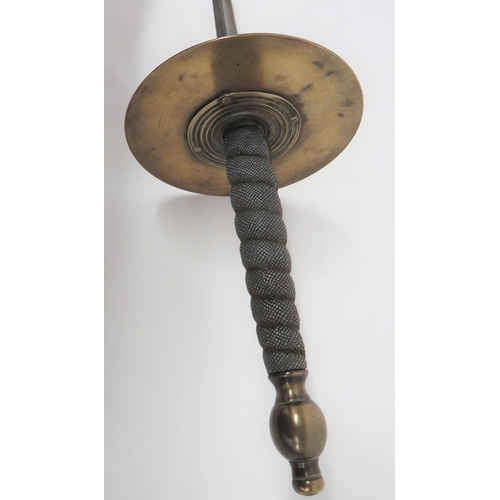 77 - Early 19th Century Fencing Sword
30 1/2 inch, hollow ground, trefoil blade.  Large, brass disk ... 