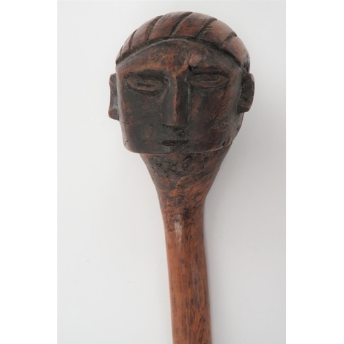 220 - Late 19th Century African Zulu Carved Head Knobkerrie 
part offset ball head carved in the form... 