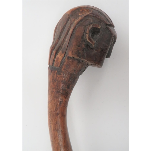 220 - Late 19th Century African Zulu Carved Head Knobkerrie 
part offset ball head carved in the form... 