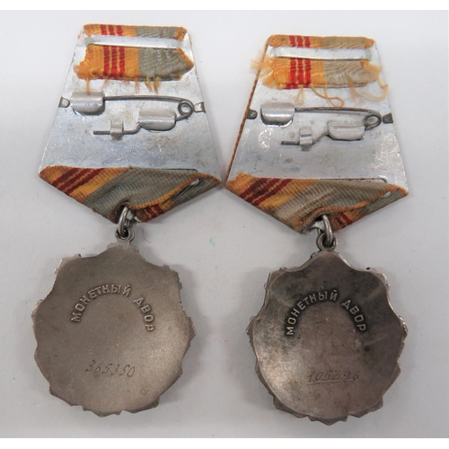 108 - Two Soviet Order of Labour Glory Medals
2nd Class examples in silvered, gilt and enamel.  Sovie... 