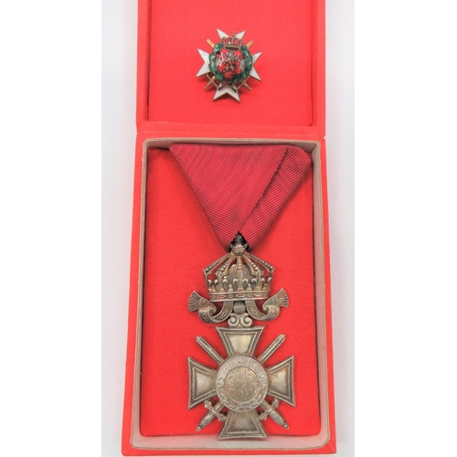 Bulgaria Order Of St Alexander
silvered cross with swords.  Top crown mount.  Together with a small gilt and enamel, Bulgarian war wreath lapel badge.  2 items.