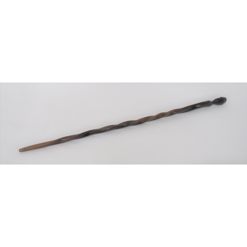 Late 19th Century Zulu Elder's Stick
carved, polished, two tone, wooden stick.  Carved native head grip.  Spiral carved shaft.  Minor wear. 