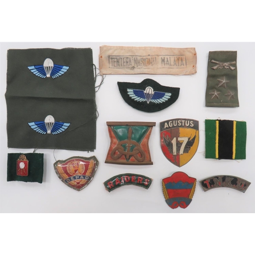 Small Selection of Overseas Special Forces Badges
including embroidery Rhodesia SAS wing ... 2 x embroidery wings .. Plastic printed Raiders title ... Painted tin TNKU title ... Plastic printed DEPAD formation ... Coloured pagri badge.  13 items.