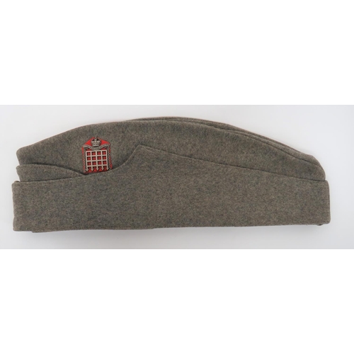 16th Queens Westminster Rifles Forage Cap
grey crown, body and curtain.  White metal, QC regimental buttons.  White metal, KC cap badge on red felt backing.  Cream linen sweatband.  Clean condition. 