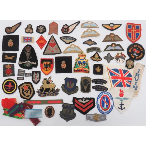 Various Military Badges
embroidery E half wing ... Embroidery, KC RCAF AG half wing ... Post war SAS beret badge ... Post war, embroidery Parachute wings ... Post war, Canadian parachute wing.  Mixed selection.  50 + items.