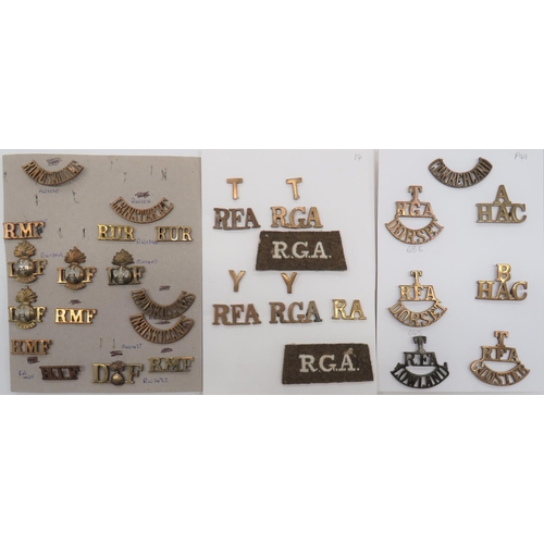 Brass Regimental Shoulder Titles
including T.RGA Dorset ... T. RFA Gloster ... T RFA Lowland ... A. HAC ... B. HAC ... RFA with separate T ... RGA with separate T ... RFA with separate Y ... Leinster RC ... RUR ... RMF ... Inniskillings ... RIF ... DF with central grenade ... 2 x embroidery RGA slip on titles.  30 items. 